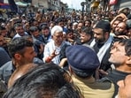 Jammu and Kashmir LG Manoj Sinha speaks with devotees during a Muharram procession, in Srinagar on Friday. (ANI)