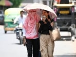People seen covering their faces due to scorching heat in Lucknow. (HT Photo) People seen covering their faces due to scorching heat in Lucknow. (HT Photo)