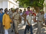 Police taking the accused to court in Ayodhya on Friday. (PTI PHOTO)