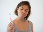 Dr Mark Burhenne is sharing the unfiltered truth about oral health during pregnancy — and why it’s about so much more than just your teeth. (Freepik)