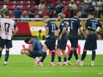 Uruguay players react following loss to Spain.