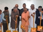 Union railways minister Ashwini Vaishnaw, Union environment minister Bhupender Yadav and UP CM Yogi Adityanath, among others, at the foundation ceremony on Saturday. (Sunil Ghosh/HT)