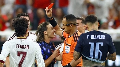 In the final minutes of the game, Uruguay's Agustin Canobbio was shown a red card for rash slide tackle on Pau Cubarsi. (REUTERS)