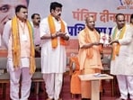 CM Yogi Adityanath, BJP MP Ravi Kishan and others at the inaugural session of the Pandit Deendayal Upadhyay Prashikshan Maha Abhiyan-2026 in Gorakhpur on Saturday. (PTI PHOTO)