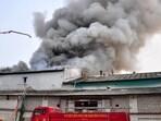 Firefighters busy with rescue efforts after the fire at the Himalayan Cold Storage in Chinhat on Sunday. (Deepak Gupta/HT)
