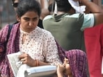 Visitors cover themselves during hot summer afternoon at Red Fort, in New Delhi, India, on Sunday, June 28, 2026.