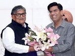 Mayor Saurabh Joshi offers a bouquet to UT administrator Gulab Chand Kataria at the special House meet on Saturday. (HT Photo)