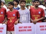 Mumbai, India - June 28, 2026: Players, parents, and football enthusiasts stage a peaceful protest at Neville D'Souza Football Ground, Bandra Reclamation in Mumbai, India, on Sunday, June 28, 2026. (Photo by Anshuman Poyrekar/Hindustan Times) (Anshuman Poyrekar/HT Photo)