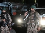 Paramilitary soldiers cordon off the streets around the Mosamiat Chowrangi area after a militant attack on Pakistan's Security Rangers compound in Karachi on June 27, 2026. Heavy gunfire was heard in Pakistan's southern megacity Karachi on June 27 evening, according to AFP journalists, following reports of an explosion. (Photo by Rizwan TABSSUM / AFP)