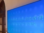 A television screen displays a message from the Pakistan Electronic Media Regulatory Authority (PEMRA) after the authority suspended the broadcast license of Geo News for 15 days over content aired during a program marking the holy month of Muharram, in Karachi, Pakistan, June 28, 2026.