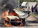 A car burns after catching fire on NH-48 near Sira in Tumakuru district, Karnataka.
