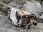 The mangled remains of the car that fell into gorge in Churah tehsil of Chamba district in Himachal Pradesh on Sunday. (HT Photo)
