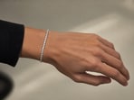 A tennis bracelet is a unisex piece of jewellery and can be worn by anyone.(Picture credit: AI generated)