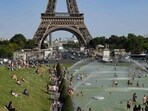 People cool off at the Trocadero Fountains next to the Eiffel Tower in Paris, on July 23, 2019 as a new heatwave hits Europe. People cool off at the Trocadero Fountains next to the Eiffel Tower in Paris, on July 23, 2019 as a new heatwave hits Europe.