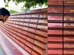 A visitor reads the names of six military personnel inscribed on the memorial wall at the National War Memorial in tribute to those who died in the line of duty during Operation Sindoor in 2025