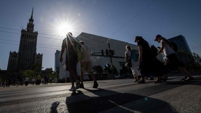 People walk through the street in the centre of Warsaw during the heatwave that has reached Poland on June 27, 2026. (AFP) People walk through the street in the centre of Warsaw during the heatwave that has reached Poland on June 27, 2026. (AFP)