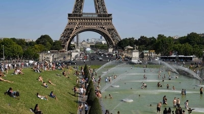 People cool off at the Trocadero Fountains next to the Eiffel Tower in Paris, on July 23, 2019 as a new heatwave hits Europe. (AFP) People cool off at the Trocadero Fountains next to the Eiffel Tower in Paris, on July 23, 2019 as a new heatwave hits Europe. (AFP)