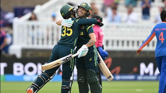 Australia's Georgia Wareham (L) and Ashleigh Gardner celebrate their win over India at the T20 World Cup. (AFP)