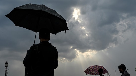 Rain clouds hover over the Kartavya Path, in New Delhi. (PTI)