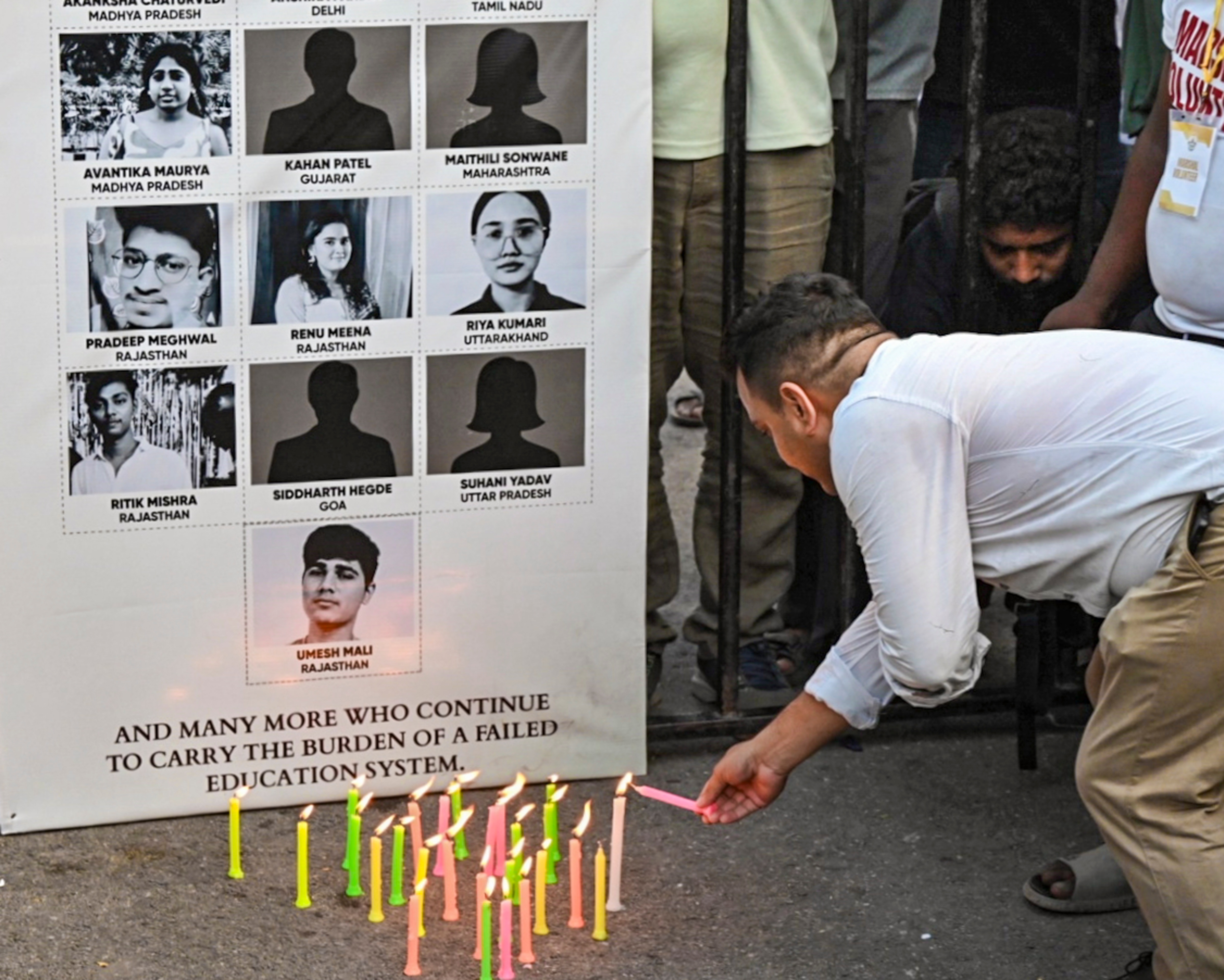 A Cockroach Janta Party (CJP) supporter light candles during a memorial vigil for students who allegedly died by suicide following the NEET-2026 examination paper leak, in New Delhi. (PTI) A Cockroach Janta Party (CJP) supporter light candles during a memorial vigil for students who allegedly died by suicide following the NEET-2026 examination paper leak, in New Delhi. (PTI)