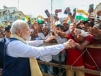 Prime Minister Narendra Modi interacts with people as he visits Navasakthi Vinayagar Temple, in Victoria on Monday.