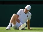 Jannik Sinner of Italy reacts as after falling over during the men's singles match against Miomir Kecmanovic of Serbia at the Wimbledon