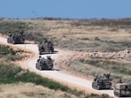 FILE PHOTO: An Israeli military artillery unit drives into Lebanon after crossing the Israeli‑Lebanese border, as seen from northern Israel. 
