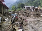 Mud-covered scooters lie amid debris after a devastating flash flood struck the NEEPCO Colony, in Keyi Panyor district, Arunachal Pradesh on Monday. (PTI)