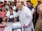 Union home minister Amit Shah with Gujarat chief minister Bhupendra Patel during the statewide Pulse Polio immunisation campaign, in Gandhinagar, Gujarat.