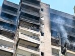 The blaze was controlled within half-an-hour, and the occupants of the flat managed to evacuate before the fire could engulf the entire apartment, said fire officials. Times) (HT Photo)
