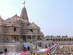 People attend the 'Dhwajarohan' ceremony at the Ram Temple, in Ayodhya, Uttar Pradesh. 