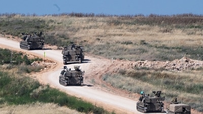 FILE PHOTO: An Israeli military artillery unit drives into Lebanon after crossing the Israeli‑Lebanese border, as seen from northern Israel. (REUTERS)