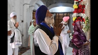 Sikh pilgrims offer prayers during a ceremony to commemorate the death anniversary of Maharaja Ranjit Singh inside Gurdwara Dera Sahib in Lahore on Monday. (AFP)