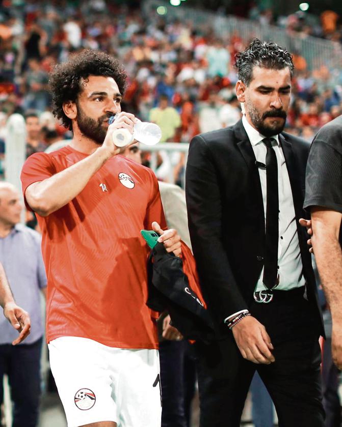 Karim Abdou guards Egypt and Liverpool icon Mohamed Salah. Karim Abdou guards Egypt and Liverpool icon Mohamed Salah.