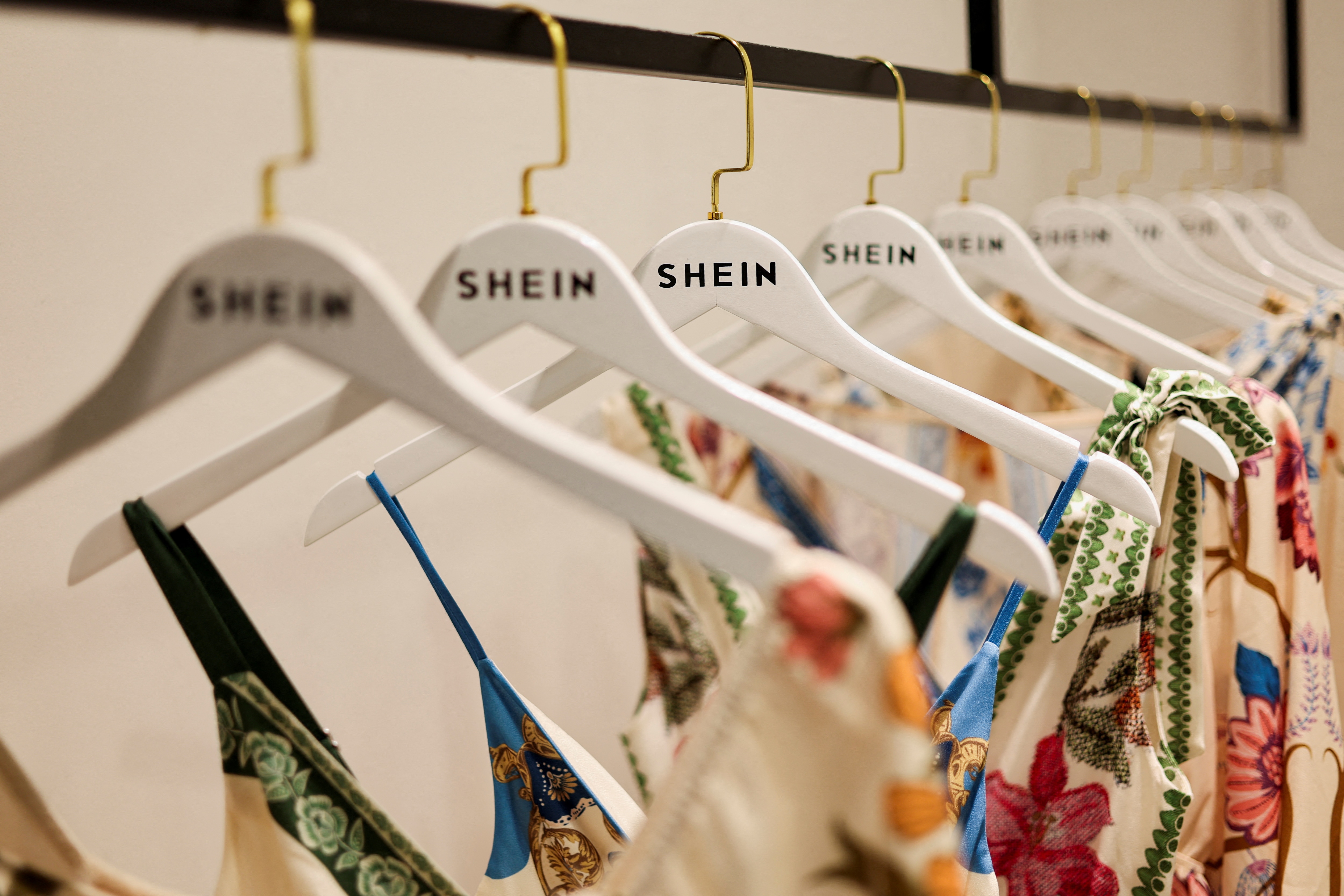 Clothes from fast-fashion brand Shein hang at their office. (Reuters)