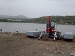 According to PMC officials, floating spider machines are equipped to access deep, narrow and difficult-to-reach sections of lakes, rivers and streams. (MAHENDRA KOLHE/HT)