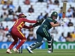 Beth Mooney hits the ball over West Indies' Shemaine Campbelle. 