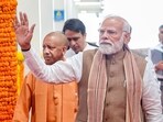 The hoardings feature photographs of PM Modi and Yogi Adityanath.