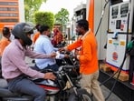 People refuel their vehicles at a petrol pump, in Amritsar. People refuel their vehicles at a petrol pump, in Amritsar.