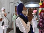 Sikh pilgrims offer prayers during a ceremony to commemorate the death anniversary of Maharaja Ranjit Singh inside Gurdwara Dera Sahib in Lahore on Monday. (AFP)