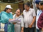 The exercise, which began across all 13 districts of the national capital, will continue till July 29, with BLOs visiting every household to distribute and collect enumeration forms as part of the revision exercise. (Sanchit Khanna/HT Photo)