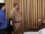 UP Congress Committee president Ajay Rai interacts with officials as he is placed under house arrest at a hotel ahead of a proposed visit by a party delegation to offer prayers at the Ram temple, in Ayodhya, on Tuesday. (PTI)