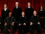 Seated (L-R): Justices Sonia Sotomayor, Clarence Thomas, Chief Justice John G. Roberts, Jr., Samuel A. Alito, Jr. and Elena Kagan. Standing (L-R): Justices Amy Coney Barrett, Neil M. Gorsuch, Brett M. Kavanaugh and Ketanji Brown Jackson. REUTERS/Evelyn Hockstein/File Photo