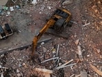 This aerial view shows workers searching through destroyed buildings in Caraballeda, La Guaira State, Venezuela.