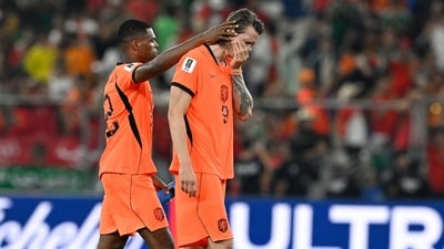 Netherlands' defender #22 Denzel Dumfries and forward #09 Wout Weghorst react after losing the penalty shootout. (AFP) Netherlands' defender #22 Denzel Dumfries and forward #09 Wout Weghorst react after losing the penalty shootout. (AFP)