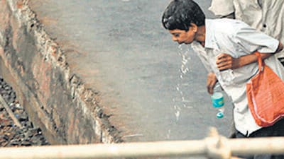 Mumbai, India - Jan. 7, 2015 : Man spitting at Bandra station, in Mumbai, India, on Wednesday, January 7, 2015. (Photo by Vidya Subramanian/ Hindustan Times) (Hindustan Times) Mumbai, India - Jan. 7, 2015 : Man spitting at Bandra station, in Mumbai, India, on Wednesday, January 7, 2015. (Photo by Vidya Subramanian/ Hindustan Times) (Hindustan Times)