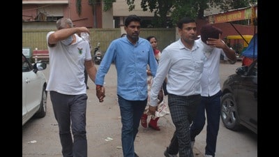 Two bank managers being produced in a court by CBI officials in Panchkula on Tuesday. (Sant Arora/HT) Two bank managers being produced in a court by CBI officials in Panchkula on Tuesday. (Sant Arora/HT)