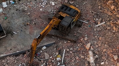 This aerial view shows workers searching through destroyed buildings in Caraballeda, La Guaira State, Venezuela. (AFP via AP)