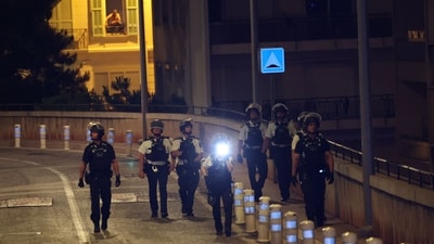 Monaco police officers patrol near the site of an explosion in a residential building in Monaco, near the French border, on June 29 (AFP) Monaco police officers patrol near the site of an explosion in a residential building in Monaco, near the French border, on June 29 (AFP)