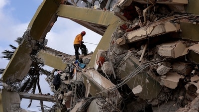 A rescuer works at the site of a collapsed building in the aftermath of earthquakes in La Guaira, Venezuela on Monday. (REUTERS) A rescuer works at the site of a collapsed building in the aftermath of earthquakes in La Guaira, Venezuela on Monday. (REUTERS)
